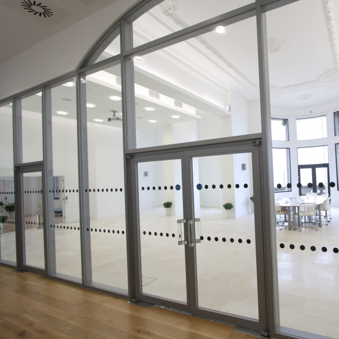 Glazed doors and partitions in a bright commercial interior